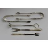 Dorothy Langlands, a pair of early 19th century Newcastle silver sugar tongs, bright cut decoration