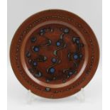 A Winchcombe pottery glazed stoneware plate, 29cm in diameter