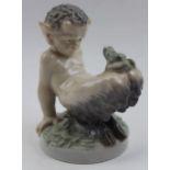 A Royal Copenhagen figure of a Faun, with a frog on his knees, 12cm high