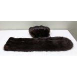 A fur stole with matching muff stole measuring 183cm long