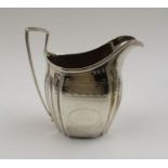 A George III silver milk jug, bright cut decoration, London 1799, 100g