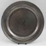 An 18th century pewter plate with triple reeded rim, bears various touch marks, including the "TS",
