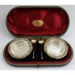William Davenport, An Edwardian pair of silver salts, embossed decoration, with plain glass liners a