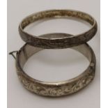 Three silver / white metal bangles, gross weight: 53g
