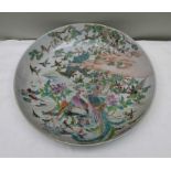 An Oriental circular dish, a deep dish with a design of many birds in trees,