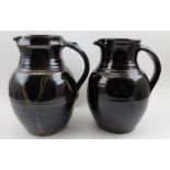 Two Winchcombe pottery treacle glazed pitcher