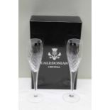 A boxed pair of Caledonian Lead Crystal champagne flutes