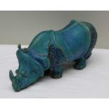 A turquoise glazed studio pottery rhinoceros, possibly after the drawing by Albrecht Durer