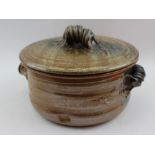 A studio pottery tureen impressed decoration and scroll handles, 20cm in diameter