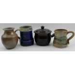 A Winchcombe pottery cobalt blue glazed studio pottery mug with applied scallop decoration