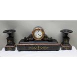 A black slate clock garniture with painted gilt highlights, with pendulum & key, 31cm high