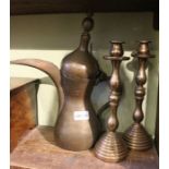 A pair of bell metal candlesticks, and an Eastern coffee pot