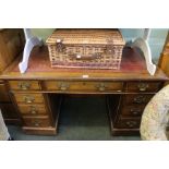 A late 19th century mahogany twin pedestal desk with skiver insert top