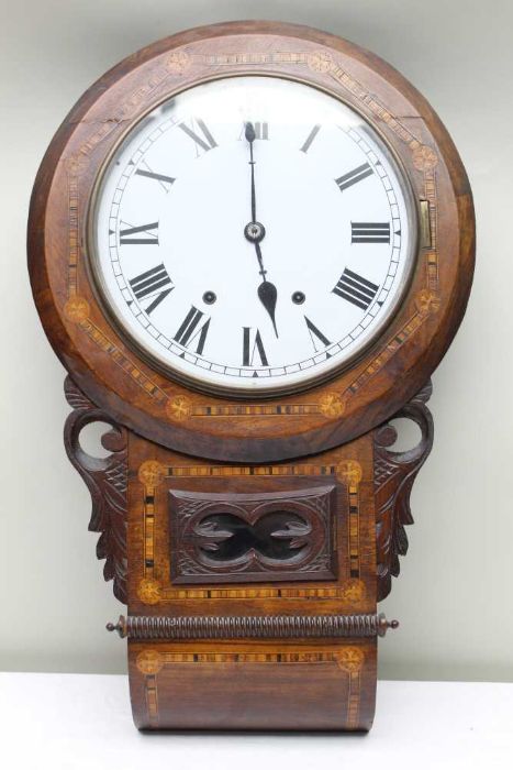 A 19th century walnut veneer wall clock, with carved & inlaid decoration, 8-day movement, 29cm dial