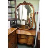 A very large probable continental mahogany dressing table with fancy shaped bevelled plate mirror su