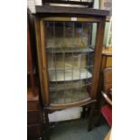 A display cabinet with leaded bow front door