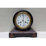 An ebonised and burr walnut clock, 22cm