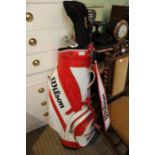 A red & white Wilson branded golf bag plus contents