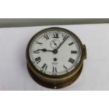 A Smiths Empire brass port hole clock with subsidiary seconds 17cm diameter