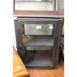 A small black glass display cabinet