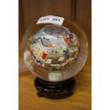 Internally painted Chinese crystal globe on wooden stand, signed