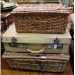 Two wicker hampers together with a suitcase