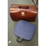 Two briefcases, one brown the other blue