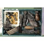 A box of African items, carvings, chess set, etc