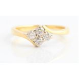 A hallmarked 18ct yellow gold diamond ring, set with four round brilliant cut diamonds in diamond-