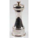 A silver peppermill, hallmarked Birmingham 2000, height approx. 15cm. BOOK A VIEWING TIME SLOT ON