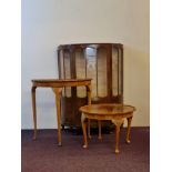 A walnut glazed single door display cabinet together with a walnut coffee table and half moon hall