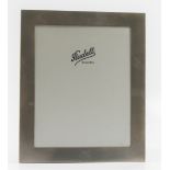 A hallmarked silver fronted photograph frame, the rectangular frame having textured finish, height