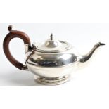A silver bachelors tea pot with wooden handle, hallmarked Sheffield 1931. BOOK A VIEWING TIME SLOT