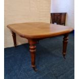 A Victorian mahogany wind out ‘D’ end dining table with two spare leaves and winder.