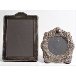 A silver fronted repousse cherub and scroll design photograph frame, hallmarked London 1985,