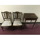 Two Edwardian rosewood inlaid chairs, together with a Victorian table with spindled legs.