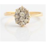 A diamond cluster ring, set with ten round cut diamonds, total diamond weight approx. 0.45ct,