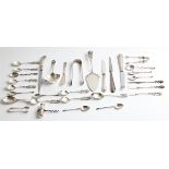 A collection of hallmarked silver flatware, to include two pairs of sugar tongs, a salt shovel, a