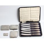 A boxed set of six hallmarked silver handled knives, together with a hallmarked silver cigarette