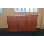 A Ercol Windsor three door high sideboard.