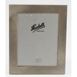 A hallmarked silver fronted photograph frame, the rectangular design having a textured finish,