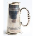 A silver spirit measure, with linear pattern round body, hallmarked Birmingham 1906, approx.