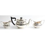 A three piece silver tea set, comprising a teapot, sugar bowl and milk jug, all hallmarked