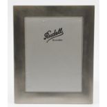 A hallmarked silver fronted photograph frame, the rectangular design having textured finish,