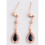 A pair of sapphire, diamond and paste drop stud earrings, each set with a pear cut sapphire,