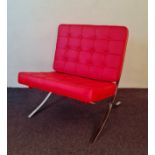 *A modern red Barcelona chair.