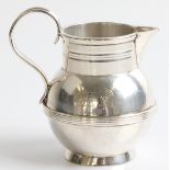 A Victorian silver jug, with engraved doe and wheel, hallmarked Dublin 1874, approx. height 6cm.