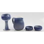 Two Molly Finlayson pottery studio vases, together with a goblet and a jug, all with blue glazing.