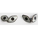 A pair of Norwegian enamel cufflinks by Askel Holmsen, each panel featuring black central flower