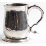 A silver tankard, possibly George II very rubbed hallmark possibly London 1739, with scroll